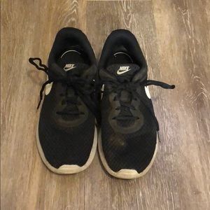 Very worn nike black running shoes